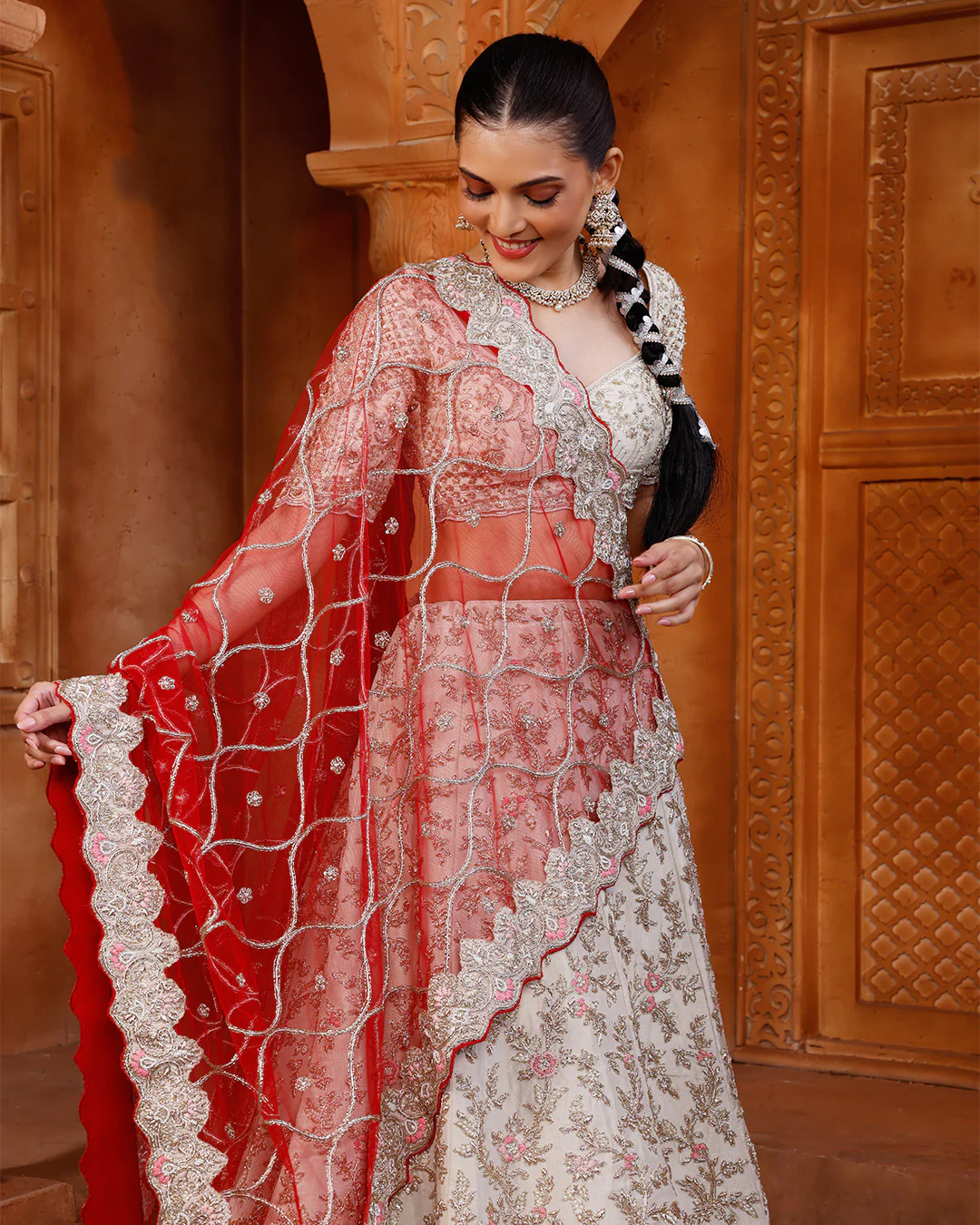 Pearl Ivory Lehenga Set With Unstitched Blouse Fabric And Contrast Red Dupatta - Image 2